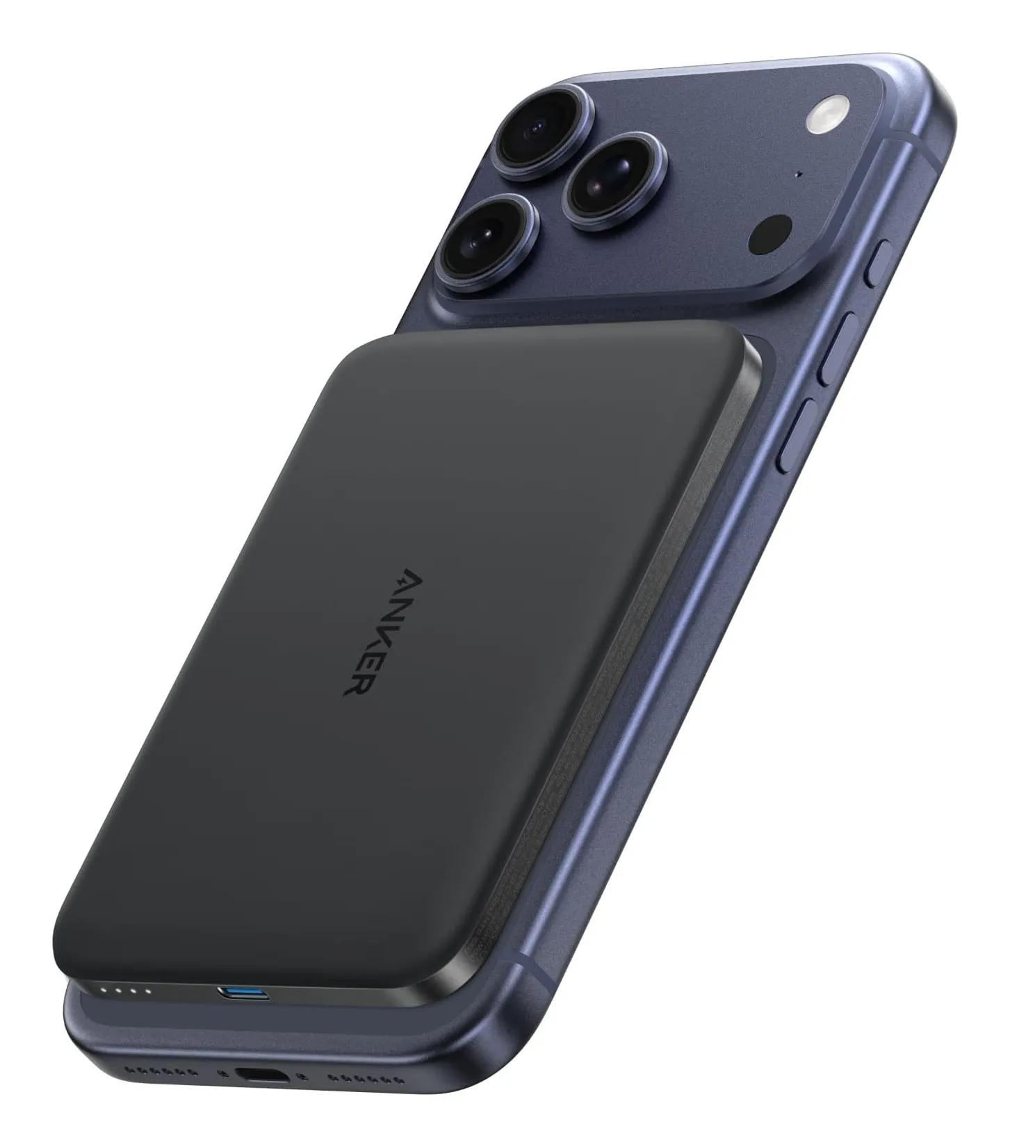 Anker Nano 5K MagGo power bank: a thin black magnetic slab attached to the back of a dark blue iPhone, with a USB-C port on its edge