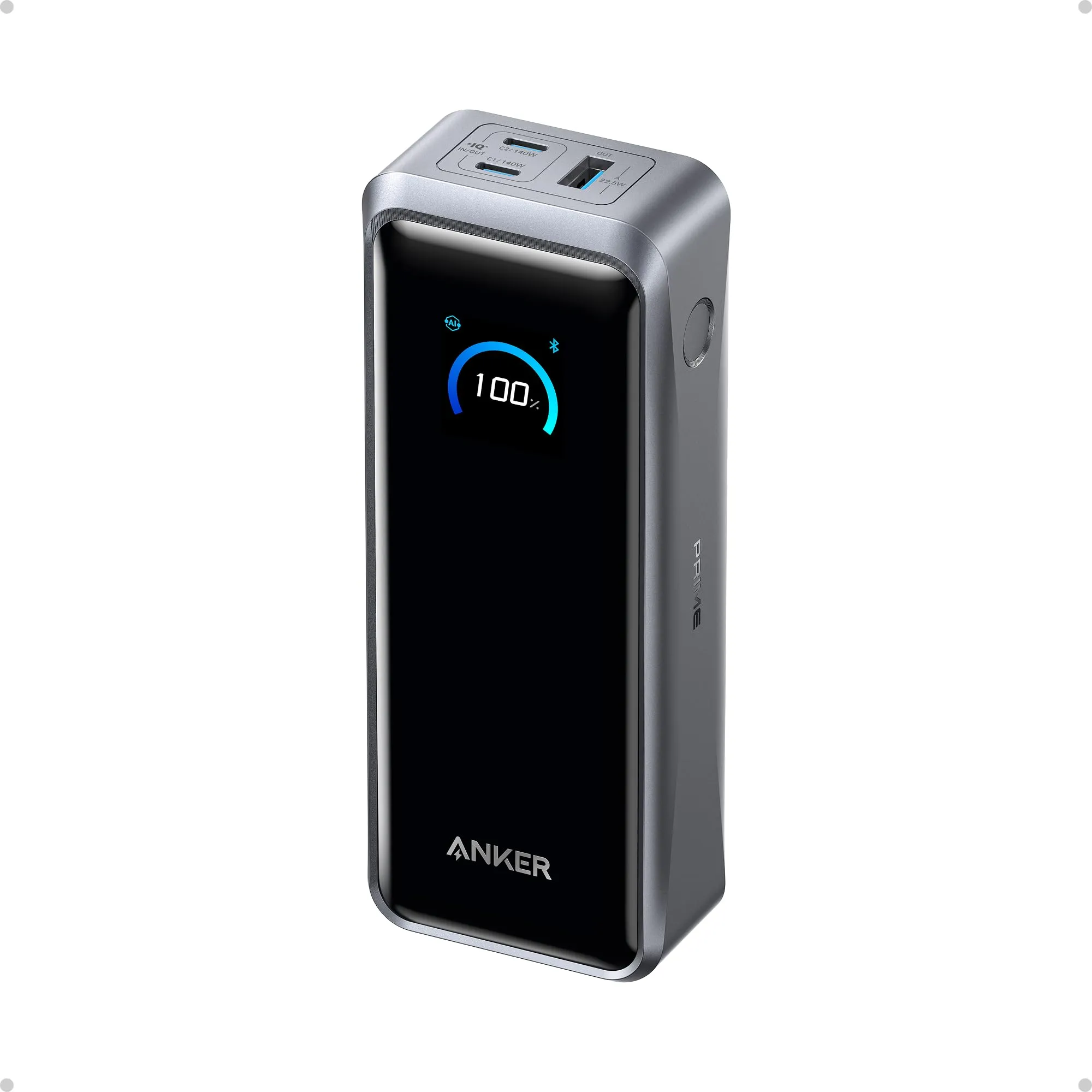 Anker Prime 26K power bank: a tall black brick with a colour display reading 100 %, two USB-C ports labelled 140 W and a USB-A port on top
