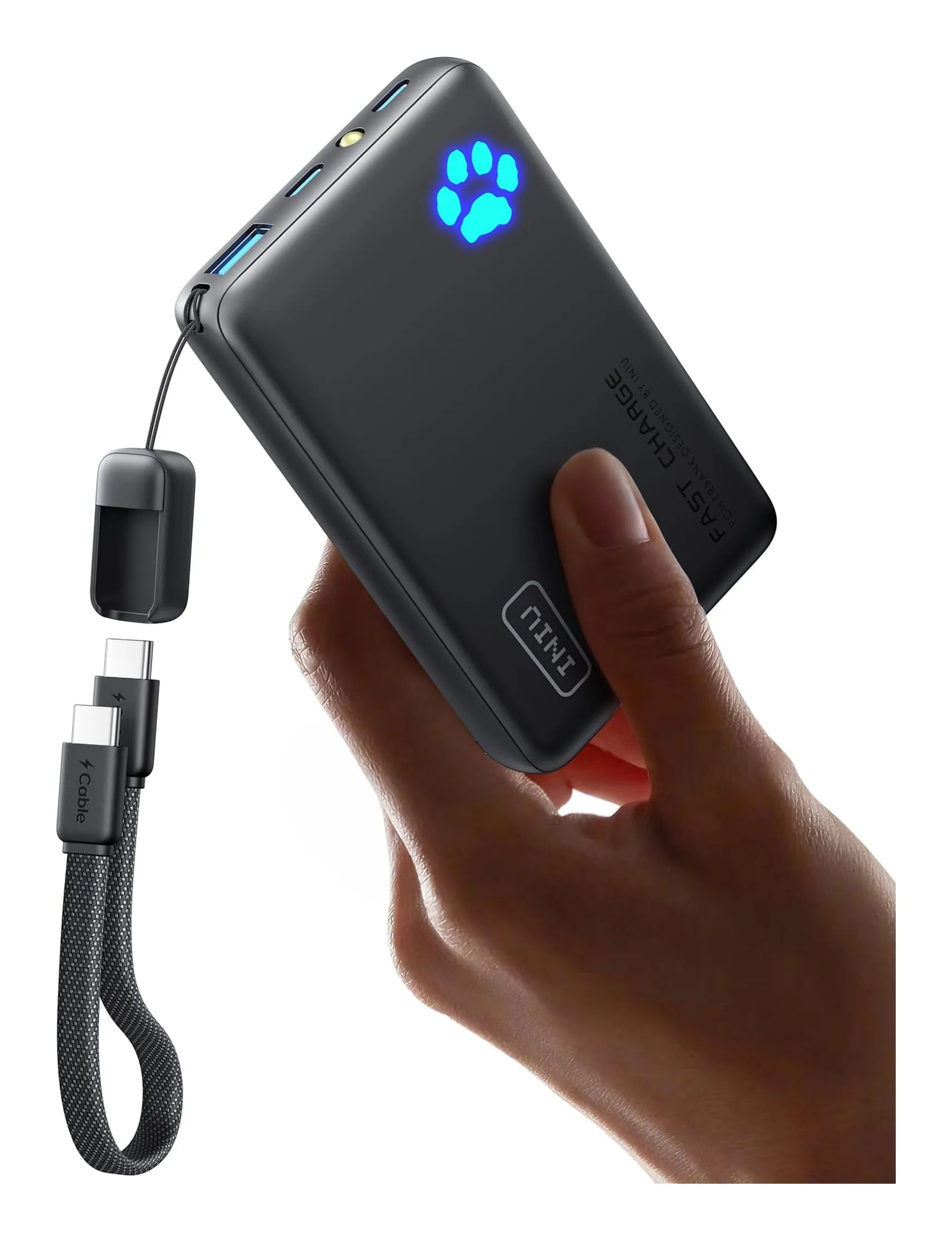 INIU P41 power bank in a hand: a black 10,000 mAh slab with two USB-C ports, a USB-A port, a torch, a glowing paw-print indicator and a short detachable USB-C lanyard cable